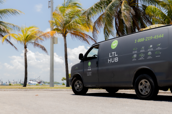 Inside Delivery vs Dock Delivery: What's the Difference? 1 LTL Truck on near Dock